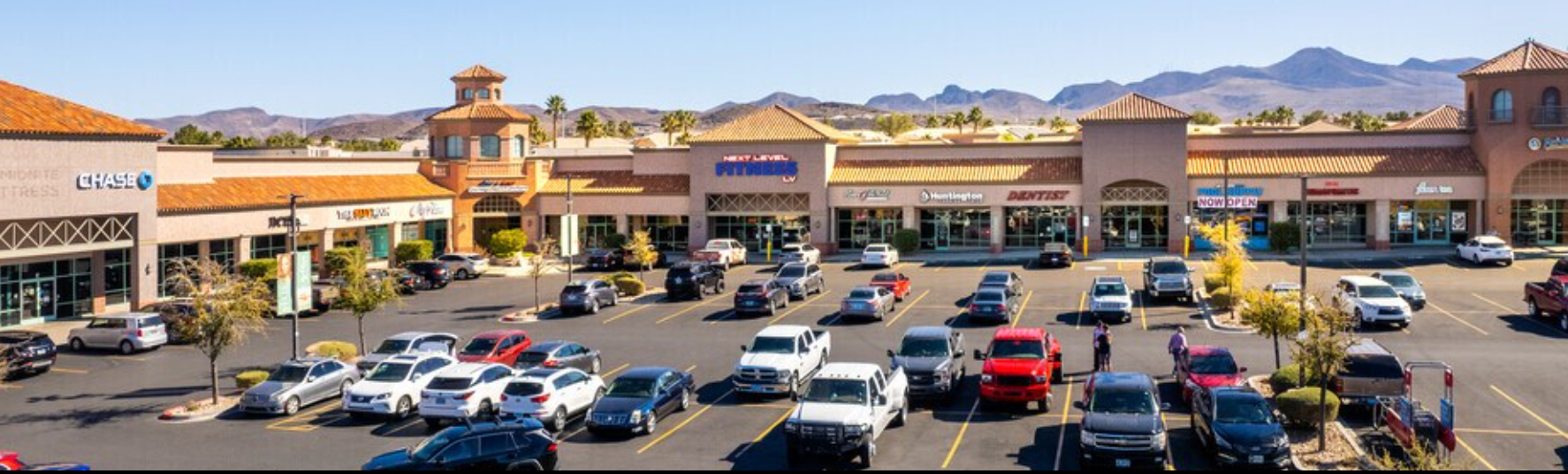 Shopping center and parking area near Moore Family Dentistry in Henderson